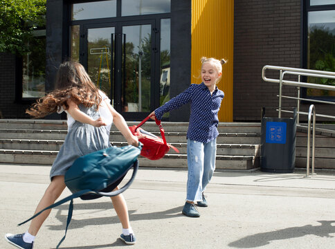 Happy, little girls are playing after school