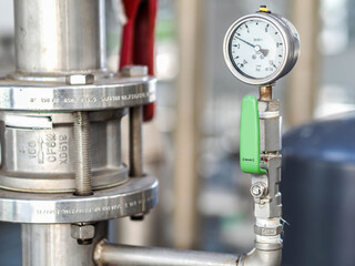 Pressure gauge of measuring instrument close up in industry zone at power plant with closed up