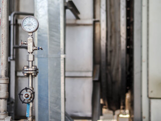 Pressure gauge of measuring instrument close up in industry zone at power plant with closed up