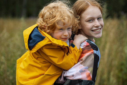 Little boy with his older  sister have fun outdoors