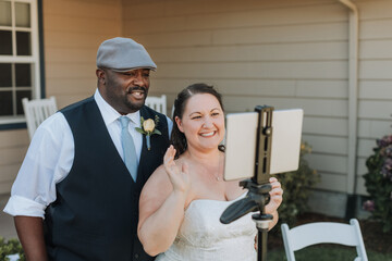 Bride and Groom Interacting with Guests at Social Distance Wedding during COVID