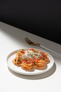 Tasty colorful appetizing cooked spaghetti italian pasta with tomato sauce bolognese and fresh basil.