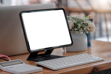 Fototapeta premium Blank screen Laptop computer and poster workspace background in modern office