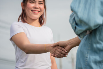 Two people shake hand friendship outdoor, Concept hand shake