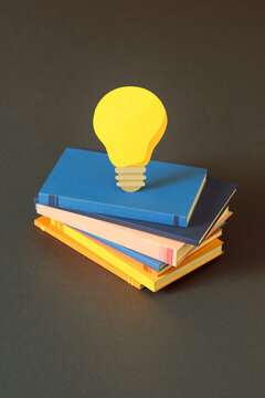 light bulb over books 