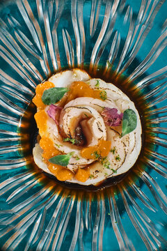 Asian food modern Japanese cuisine Tataki with seaside scallop, ponzu, mango, rose petals, lime zest