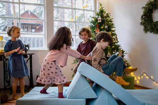 Beautiful kids having fun at Christmas time at home