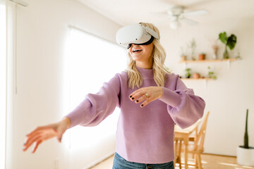 Blonde Woman Has Fun Using VR Headset