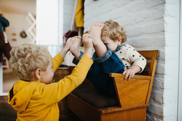 kids teasing each other at home