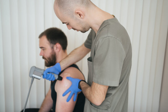 Doctor conducts treatment with patient in hospital
