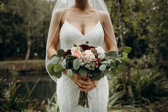 Bride Holding Bouquet featuring Eucalyptus 