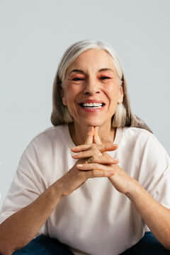 Stylish elderly woman smiling for camera