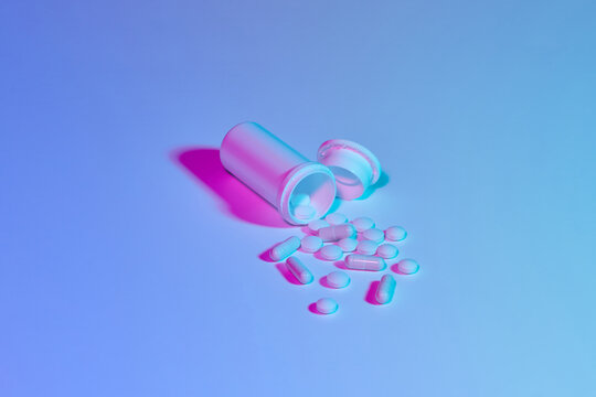 Scattered pills and bottle