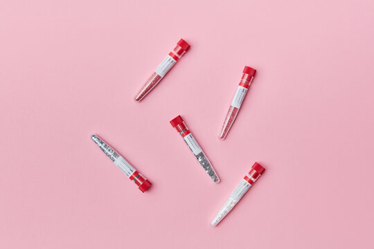 Test tubes on pink background
