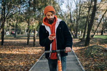 Man renting an electric scooter using smartphone