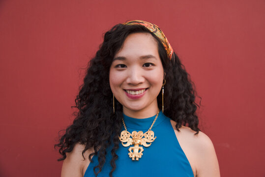 Fashionable woman smiling with curly hair