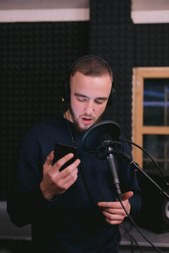 Professional musician working on song in recording studio 