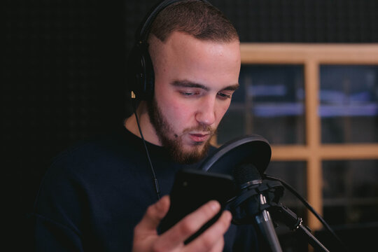 Male singer recording and creating music and songs 