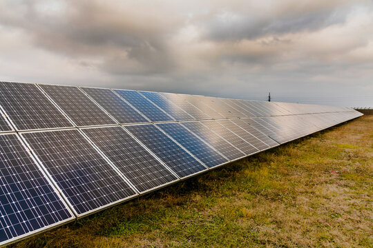 Reflection of the dramatic sky on the photovoltaic modules