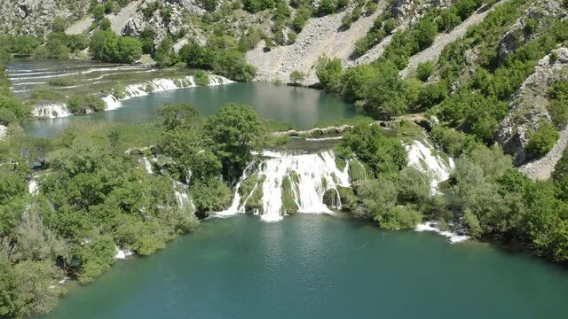 Zrmanja River Canyon - Kuda's Bridge Over Krupa River With Waterfalls In Croatia. - aerial pullback