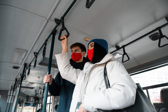 Multiracial Friends In Masks Riding Modern Bus Together