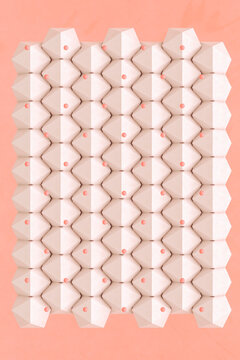 Pink platonic shapes with a pink ball on a pink background