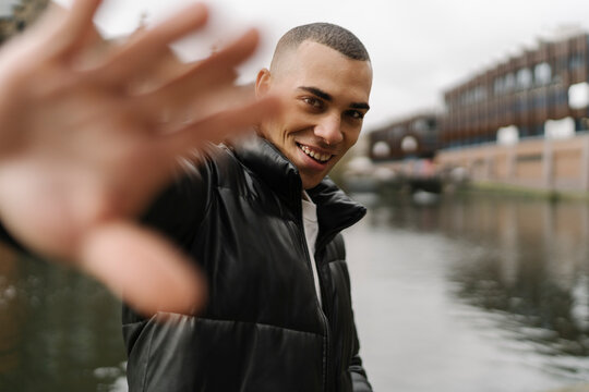 Smiling Man with Hand Stop 