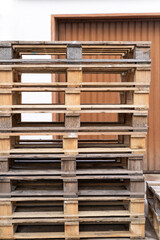 Stack of pallets in front of the garage