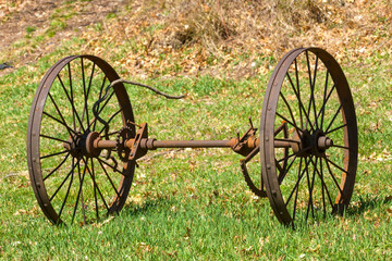 Rusty iron wheels in field at Whitaker Woods in Connecticut.