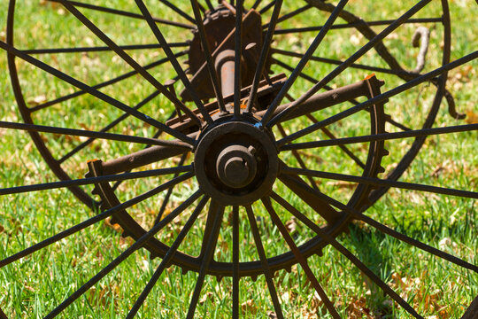 Rusty iron wheels in field at Whitaker Woods in Connecticut.