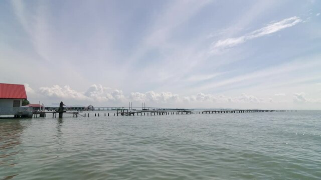 Timelapse view Teluk Tempoyak cloud morning over wooden bridge
