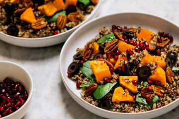 Easy winter salad with sweet potatoes, quinoa, spinach and pomegranate