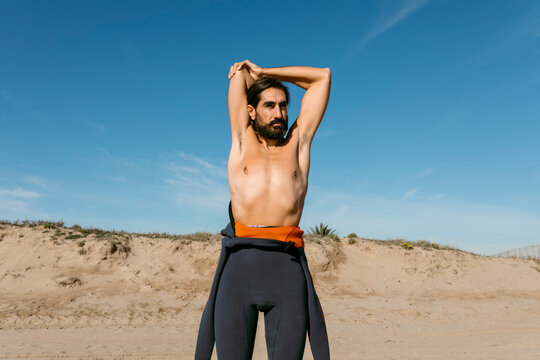 man in diving suit warming up