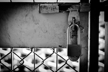 lock on the old wire mesh of cage