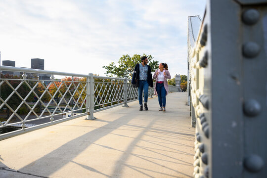 Black couple in love Walking together in City crossing bridge