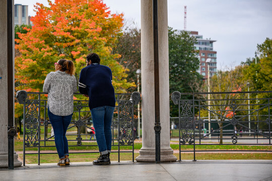 Young African American Couple talking in the City with fall foliage 