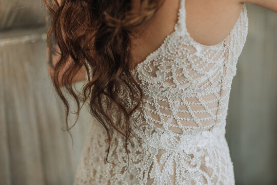 Closeup of Bride after being Zipped into Wedding Dress