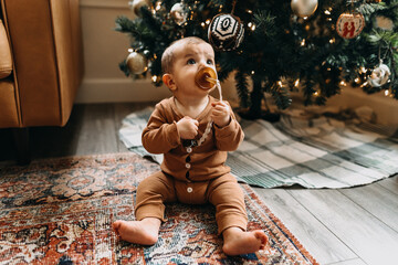 Baby in front of Christmas Tree