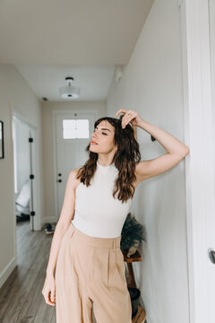 Woman Standing In Hallway