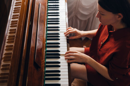 Close up on a woman playing piano