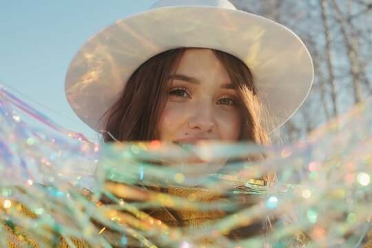 Happy young woman with tinsel
