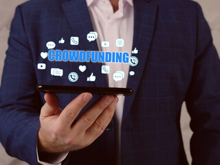  CROWDFUNDING text in search bar. Manager looking at cellphone. The use of small amounts of capital from a large number of individuals to finance a new business venture