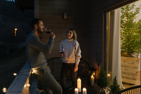Couple hangout on a terrace at Christmas evening