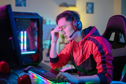 asian gamer has eyes pain