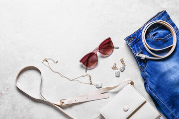 Stylish female accessories on white background