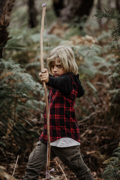 boy bowhunting