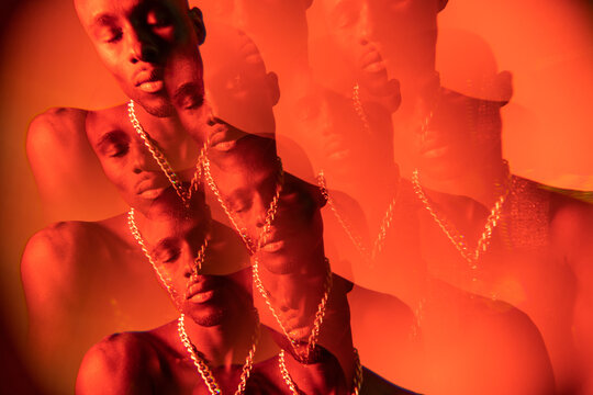 Red Portrait With Kaleidoscopic Filter Of A Black Man.