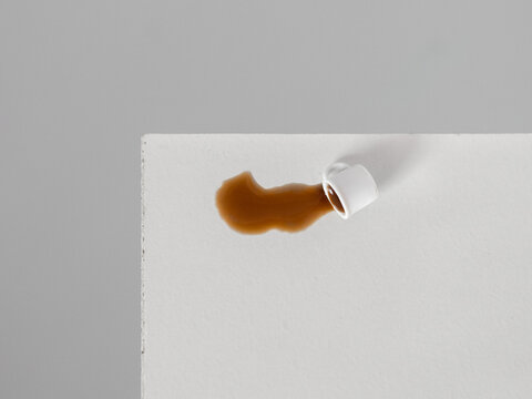 Dropped coffee cup on a white table