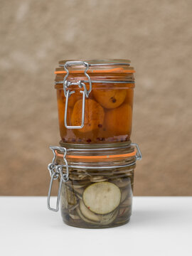 Pile of glass jars with preserved homemade pickles