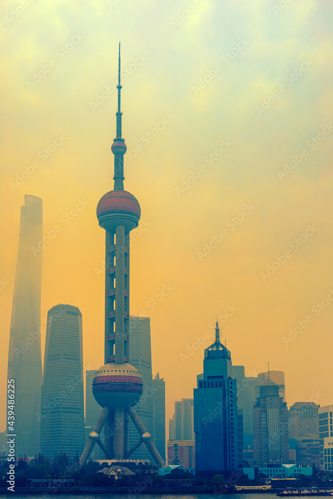 Wall mural shanghai skyline in sunny morning with cloud sky, misty and huangpu river cityscape view